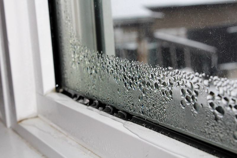 Water condensation on windows during winter causing damage